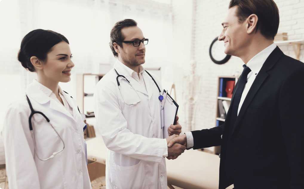 doctor shaking hand with a member